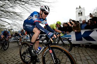 WEVELGEM BELGIUM MARCH 24 Kasper Asgreen of Denmark and Team Soudal QuickStep competes passing through the Kemmelberg Belvedre cobblestones sector during the 86th GentWevelgem in Flanders Fields 2024 Mens Elite a 2531km one day race from Ieper to Wevelgem UCIWT on March 24 2024 in Wevelgem Belgium Photo by Tim de WaeleGetty Images