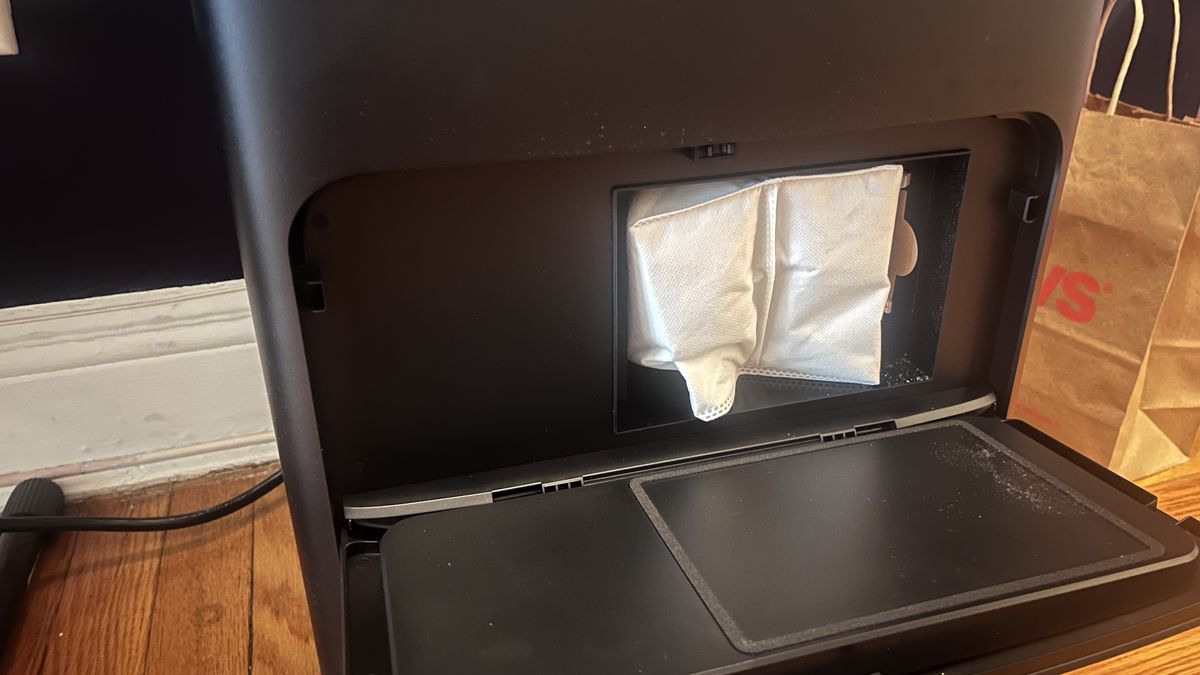 The DEEBOT X2 automatically empties the debris collected into a dust bag into the cleaning station