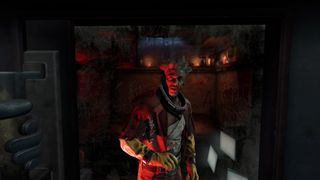 Screenshot from Batman: Arkham Shadow showing the Ratcatcher in his cell in Arkham.