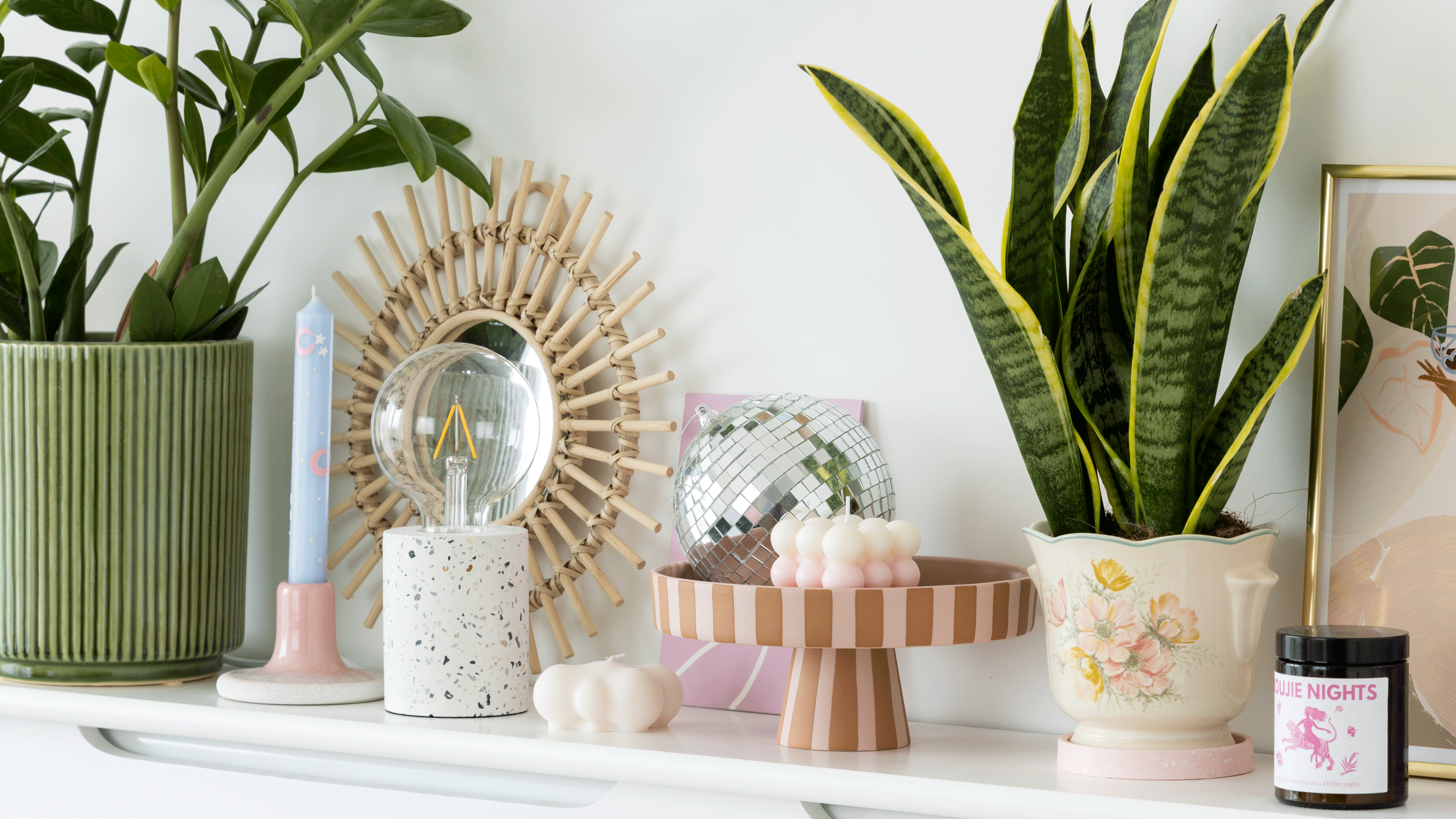 Stone shelf with artwork, candle and vases