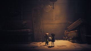 Little Nightmares 3 characters stand in a dimly lit room, filled with suitcases and a broken mirror
