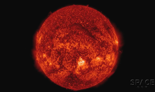 A filament can be seen on the upper center region of the sun.