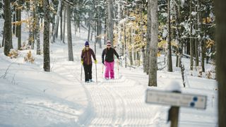 Two women snowshoeing