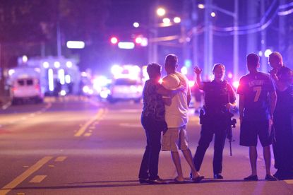 Family members wait for information after Sunday's massacre in Orlando.