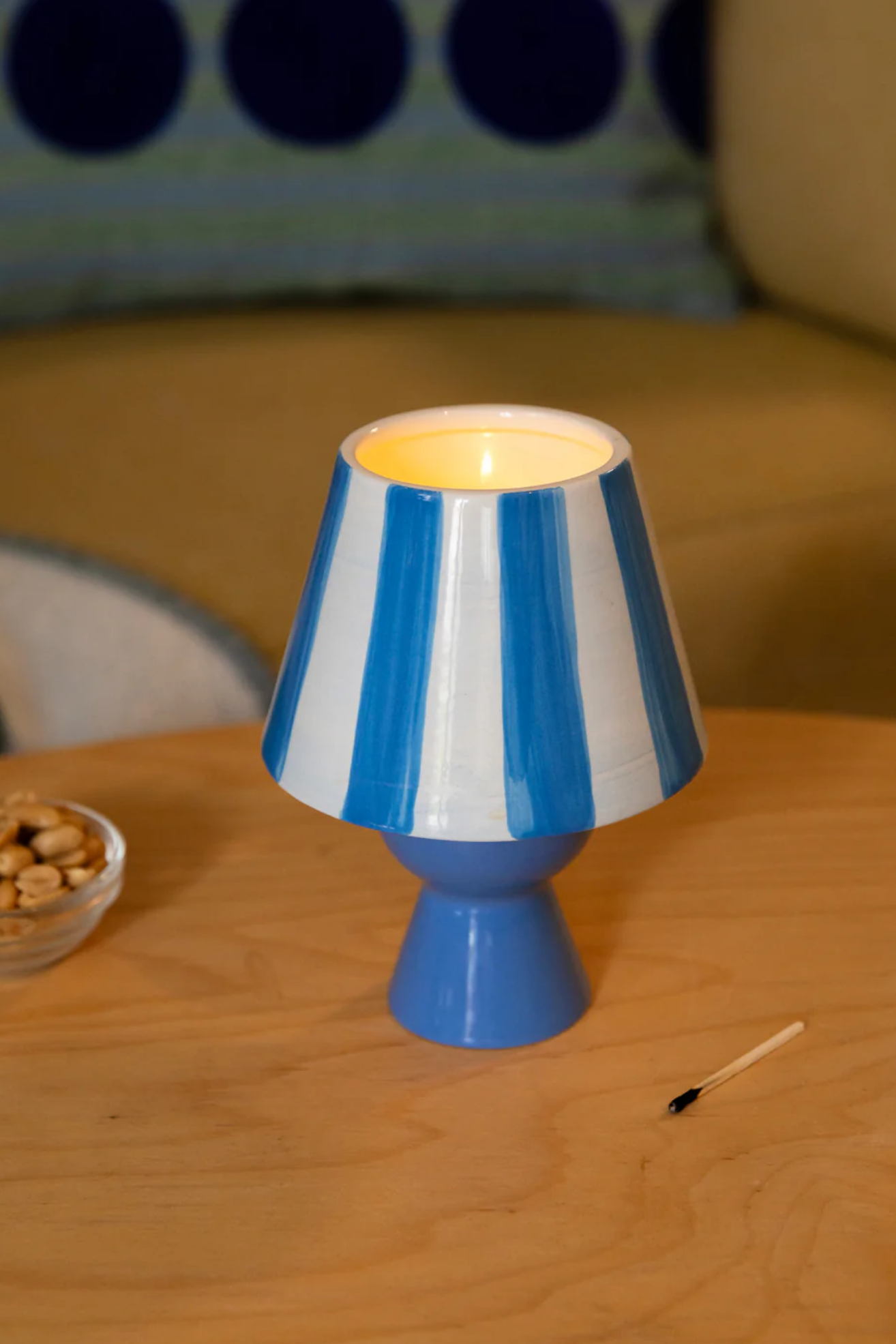 A striped blue and white tealight lamp