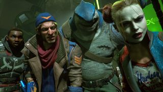 Deadshot, Captain Boomerang, King Shark and Harley Quinn stand side by side looking into the camera