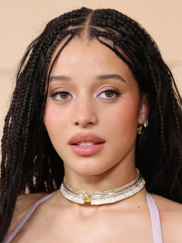 Chase Infiniti attends the 98th Oscars at Dolby Theatre on March 15, 2026 in Hollywood, California wearing a lilac dress and matching lilac eyeshadow