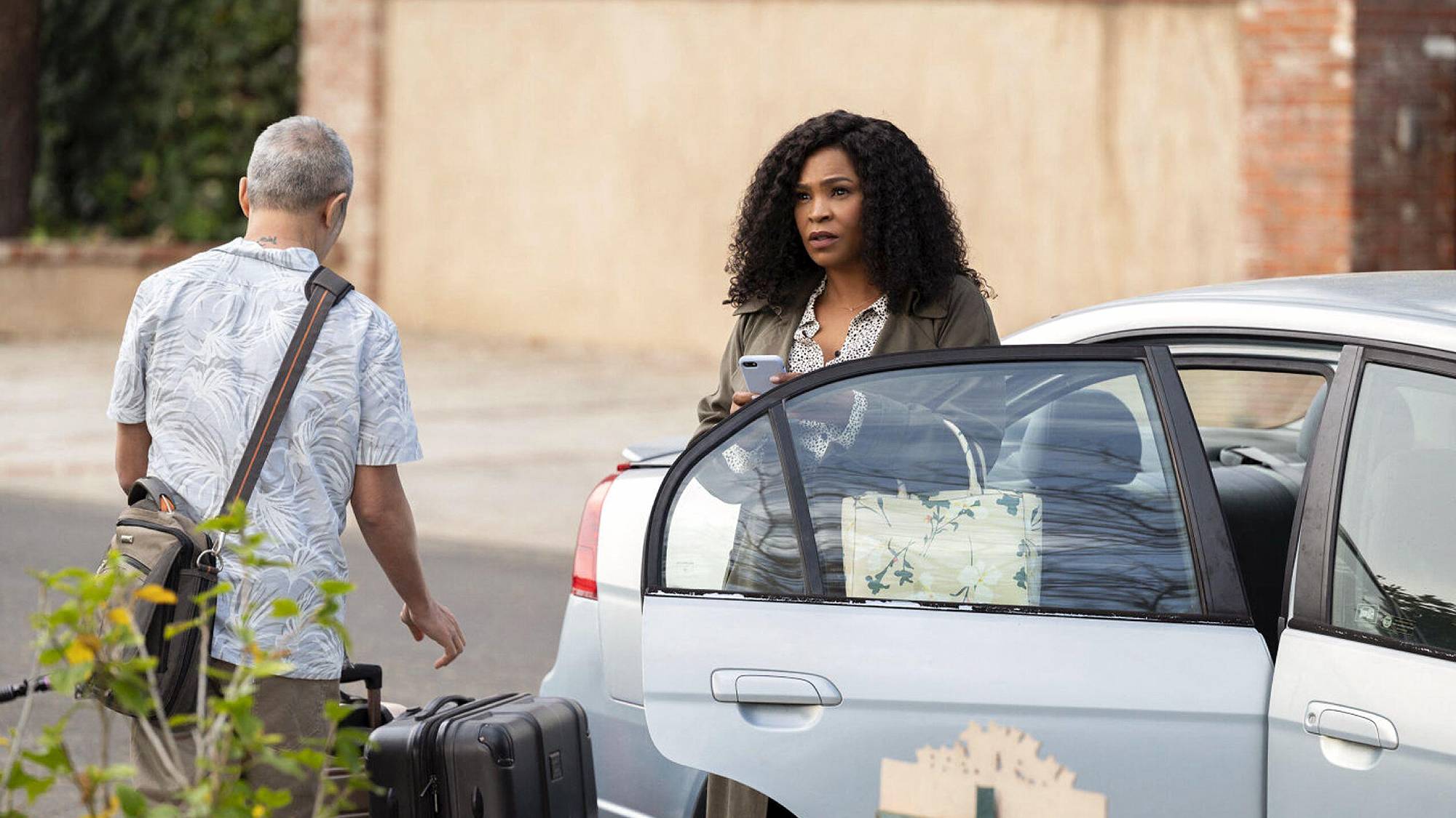 Ken Leung as Kevin Lin and Nia Long as Grace in "Missing" film (2023)