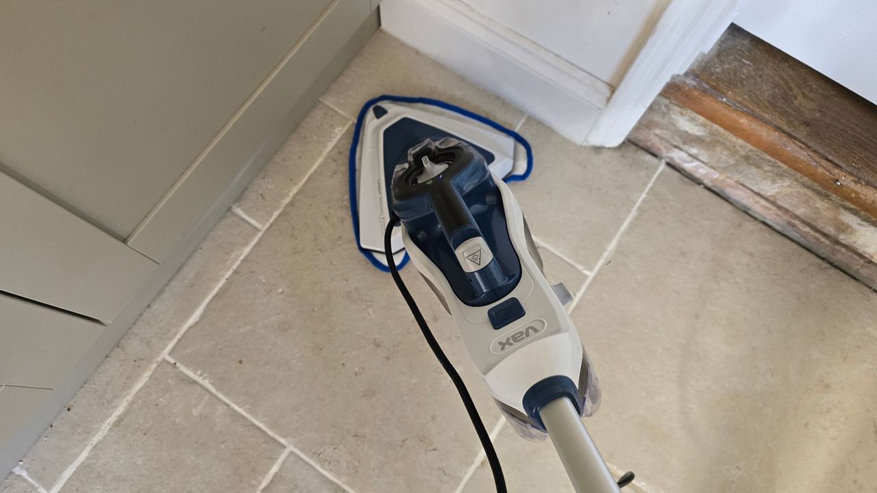 Vax Steam Fresh Total Home cleaning floor with triangular brush head