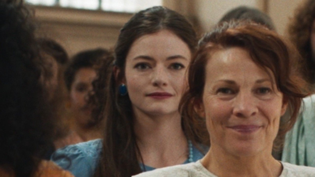 From left to right: Mackenzie Foy standing behind Lili Taylor in The Conjuring: Last Rites. 