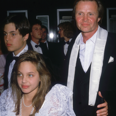 American actor Jon Voight (right) attends the Academy Awards with his son James Haven Voight (left) and daughter Angelina Jolie Voight, at the Dorothy Chandler Pavilion, Los Angeles, California, March 24, 1986.