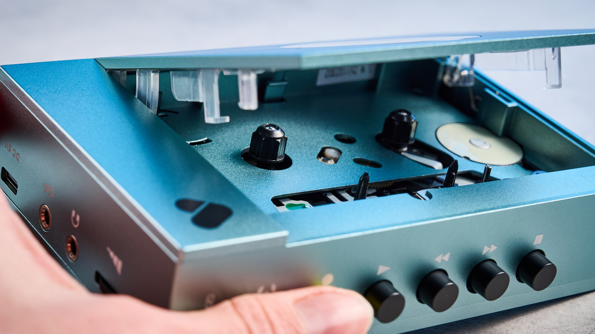We Are Rewind Cassette Player in blue photographed in front of a blue background