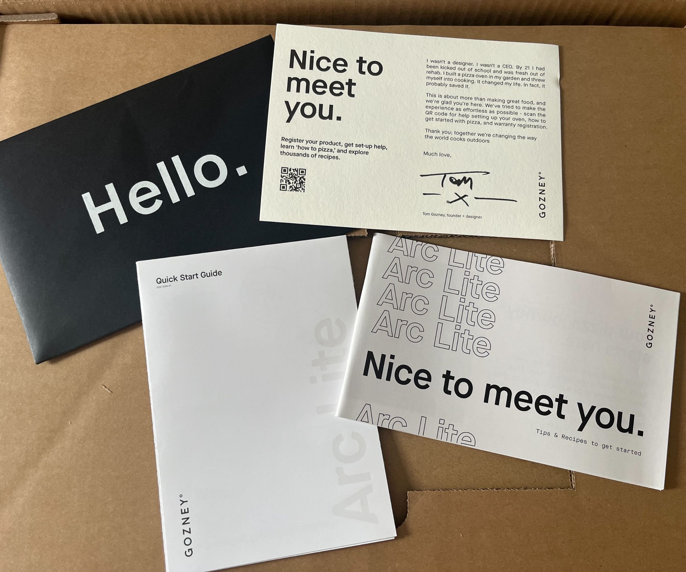 The set of starter guides on top of the Gozney Arc Lite box. 