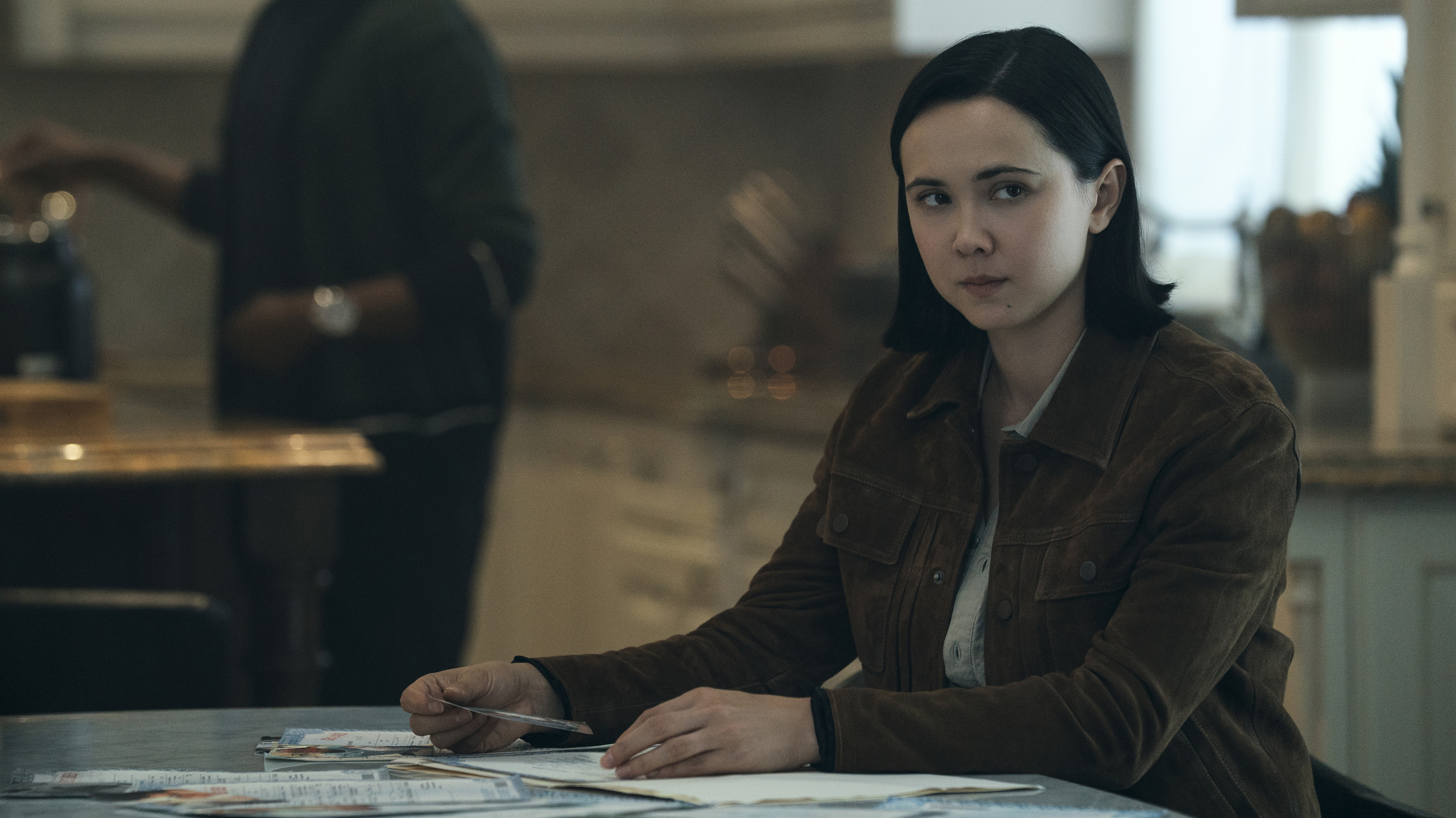 Jordan Li&#039;s female form sitting at a table in Gen V season 2
