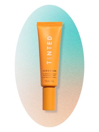 Live Tinted Hueguard 3-in-1 Broad-Spectrum Mineral SPF 30 Primer on an ombre blue and peach background