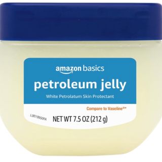 Amazon Basics petroleum jelly in a clear tub with navy lid