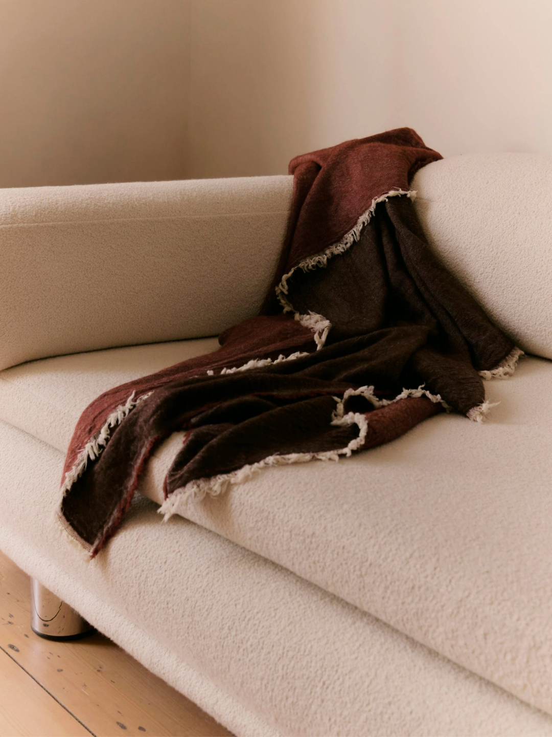 A rust colored merino wool throw from Rise &amp;amp; Fall