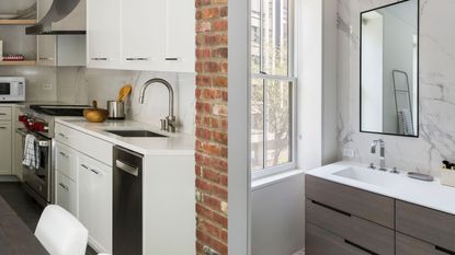 a modern kitchen with a brick wall and bathroom with marble backsplash