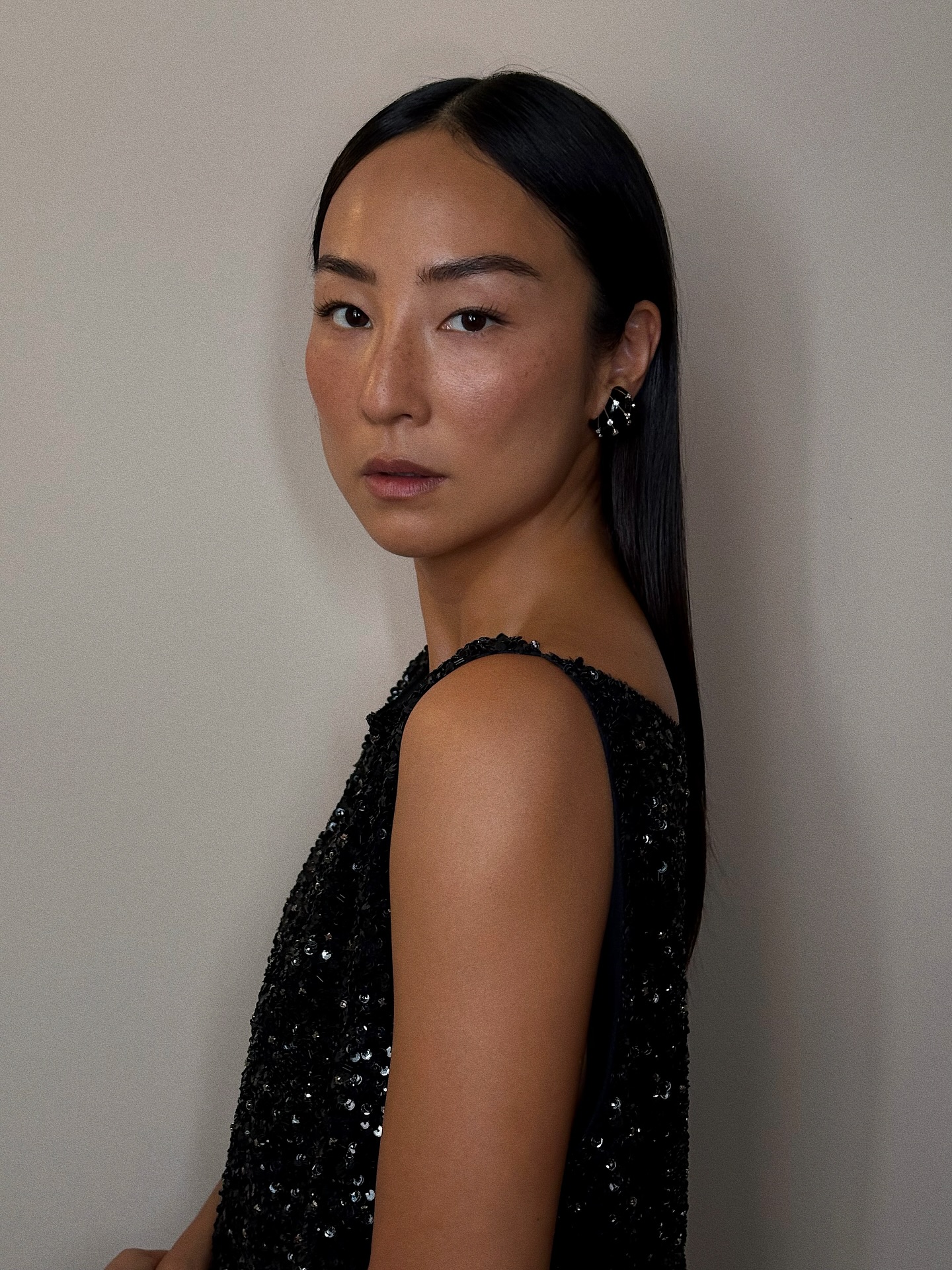 Greta Lee sleek long hairstyle