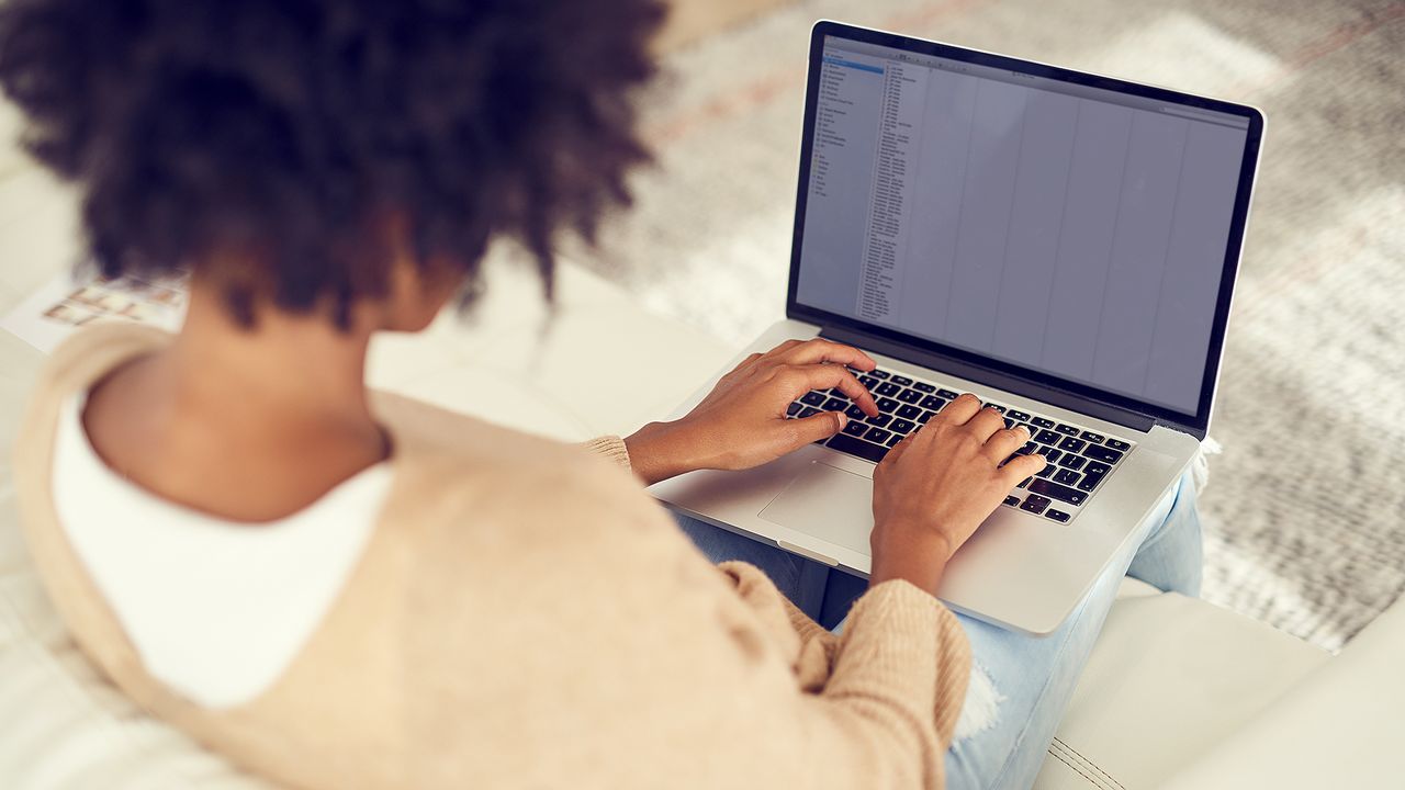 woman using laptop on her lap