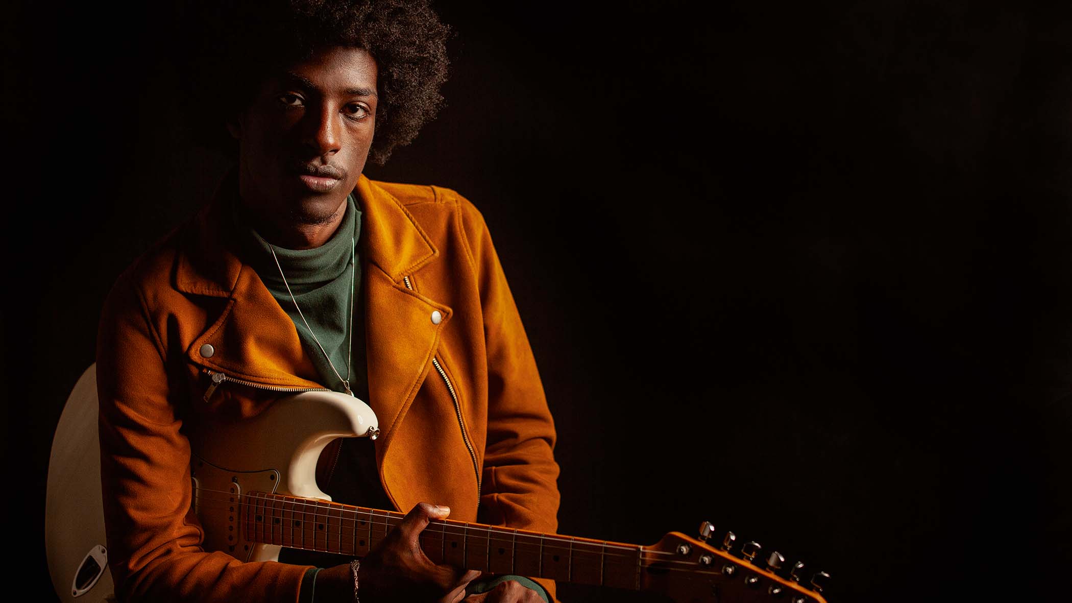 Amani Burnham with his trusty Fender Strat