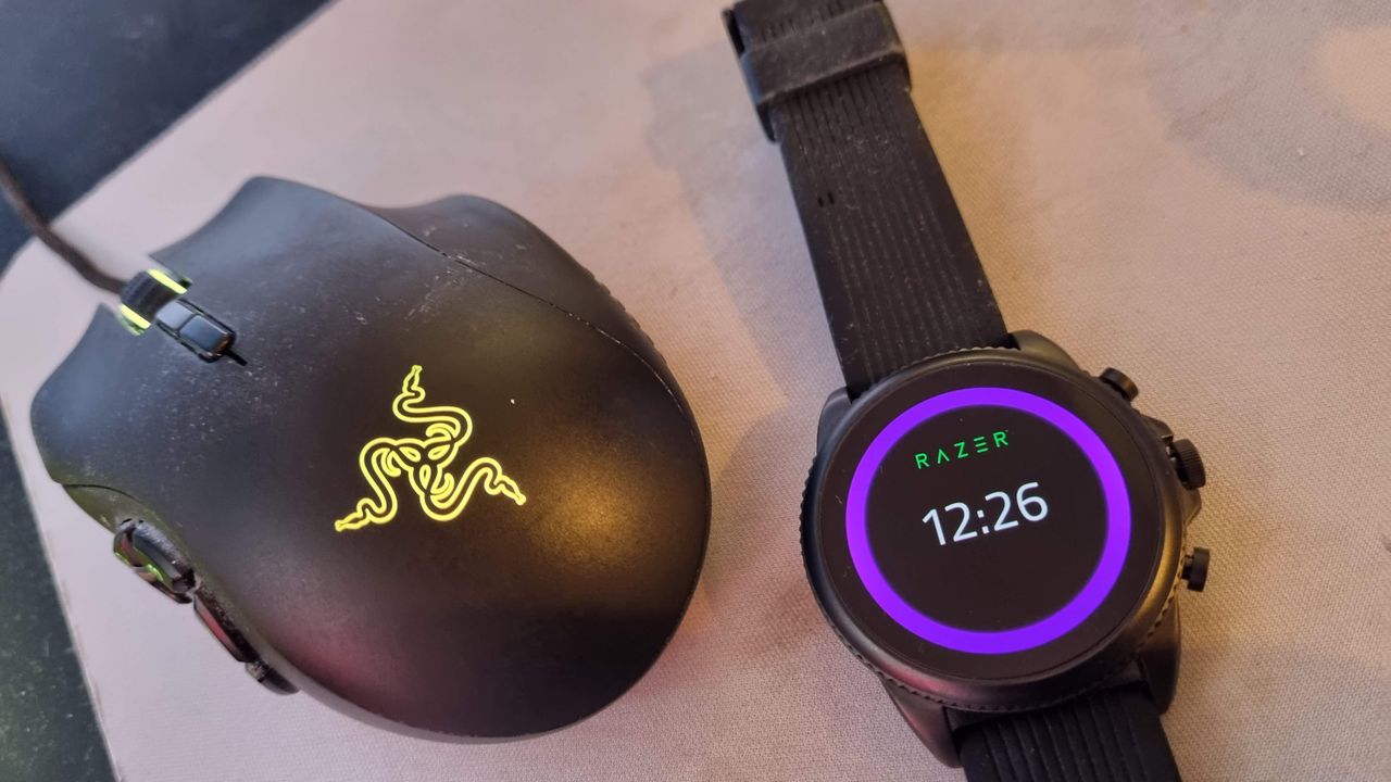 Razer X Fossil Gen 6 smartwatch on a desk with gaming peripherals