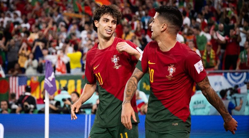 Joao Felix and Joao Cancelo celebrate a goal for Portugal at the 2022 World Cup in Qatar.