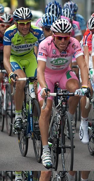 Ivan Basso eyes out the pink jersey of countryman Danilo Di Luca.