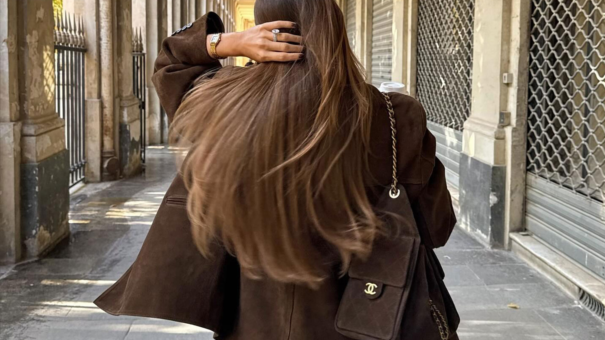 A French woman with a Chanel 25 bag.