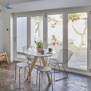 room with glass door and table chair