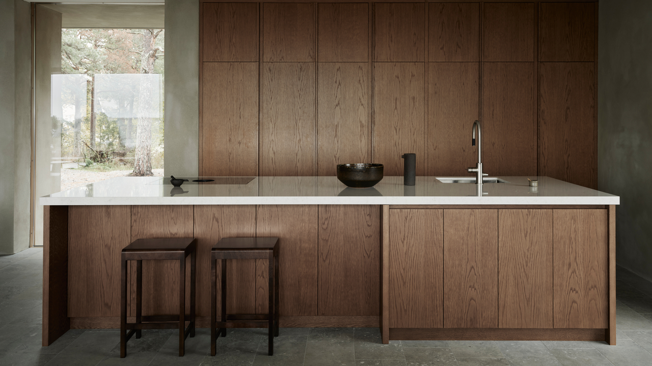 a minimalist, dark brown kitchen design