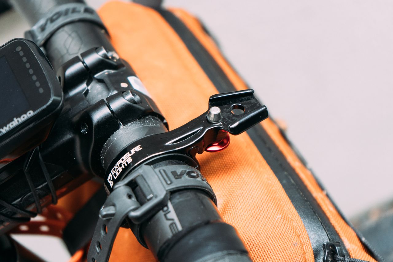 A close up of the mounting bracket for a bike light