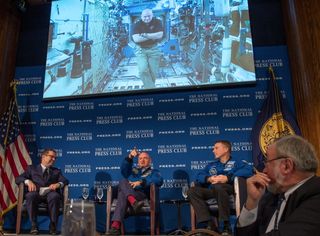 On Sept. 14, 2015, astronaut Scott Kelly participated from the International Space Station in a discussion with astronaut Terry Virts and Kelly's twin brother, retired astronaut Mark Kelly, at the National Press Club in Washington.
