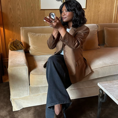 @frannfyne wears black jeans brown blazer