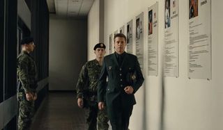 Ad Astra Brad Pitt walking down the hall in uniform