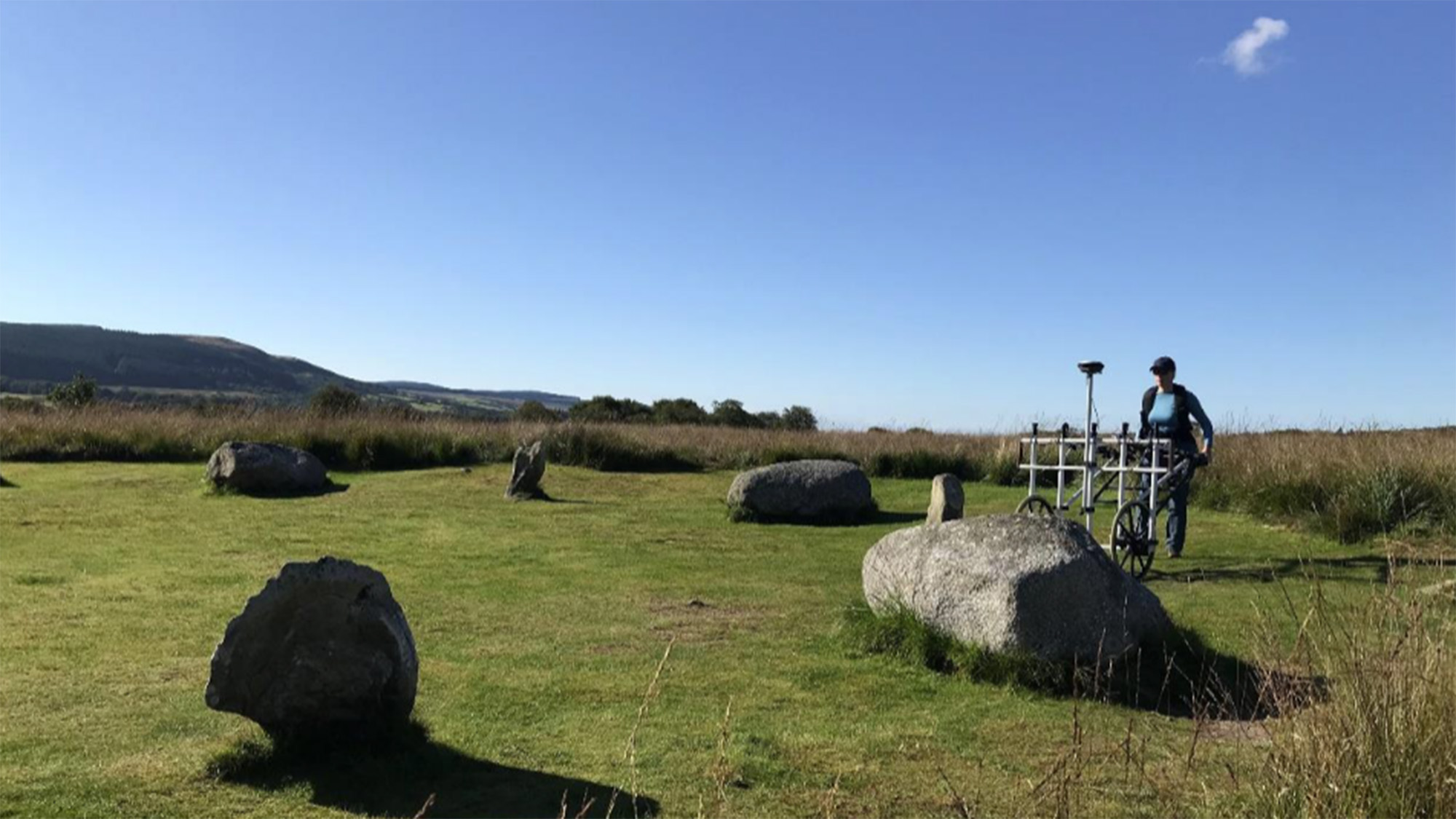A view of several stone circles on a moorland 