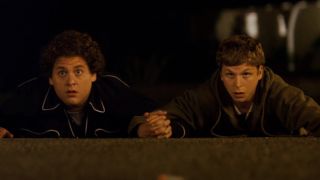 Seth and Evan holding hands in Superbad.
