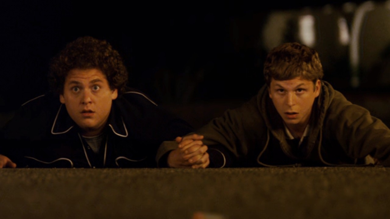 Seth and Evan holding hands in Superbad.