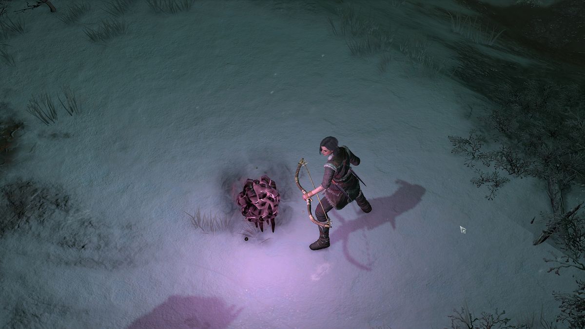 Diablo 4 Malignant Hearts - a rogue stands next to a glowing malignant heart hovering above the snow