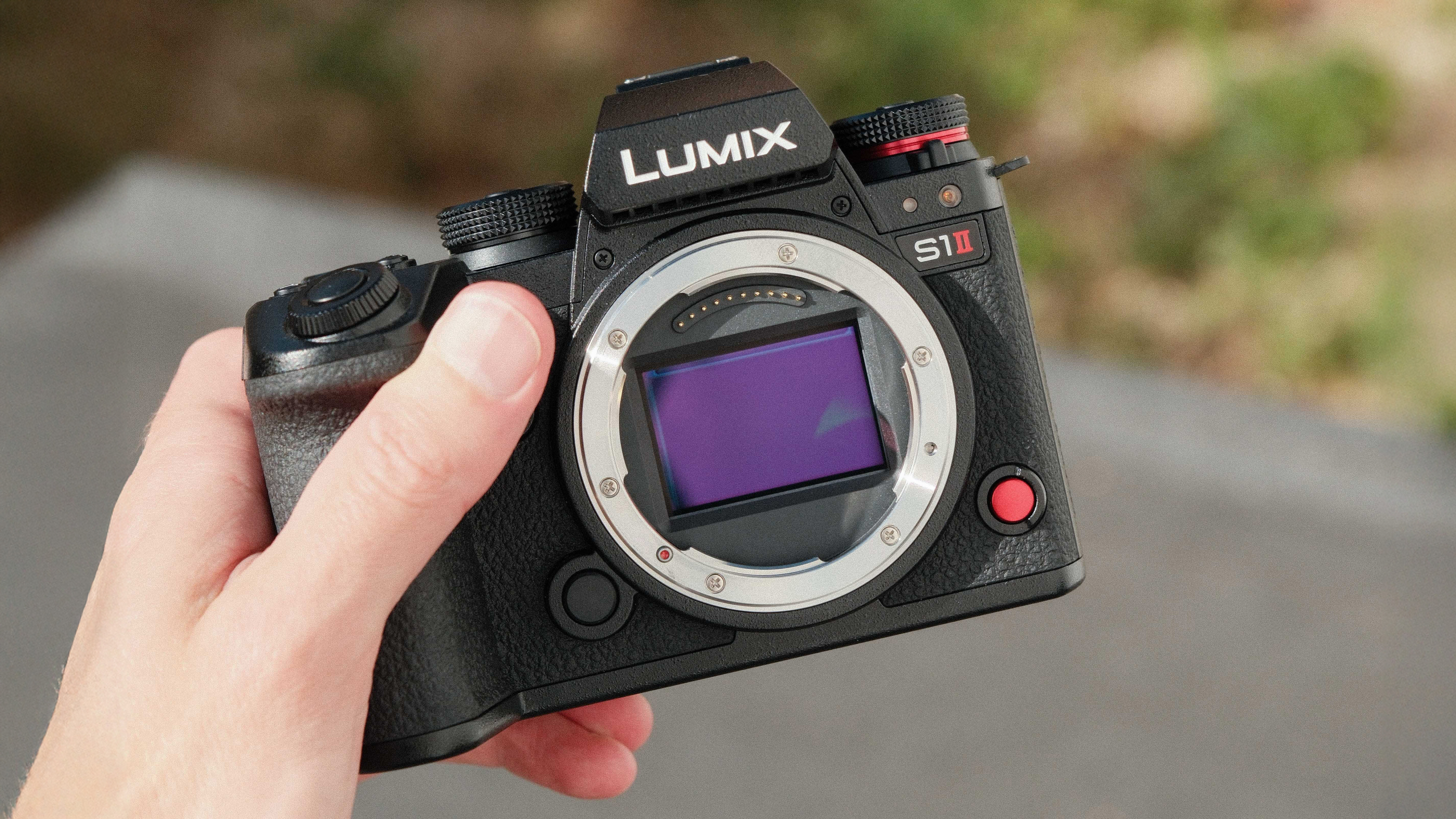 Panasonic Lumix S1 II camera held in a hand