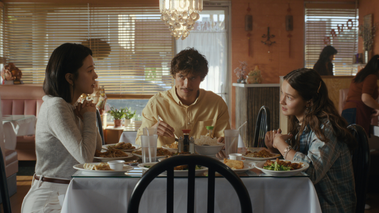 Eunice (Seoyeon Jang), Austin (Charles Melton) and Ashley (Cailee Spaeny) have lunch on Beef.