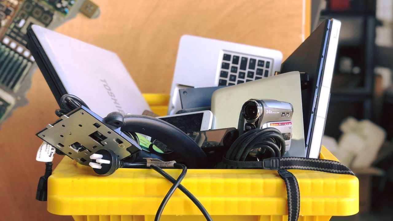 Electronic waste in yellow bin