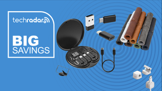 Cable organizers and desk mat on a blue background next to a TechRadar badge reading 'Big Savings'