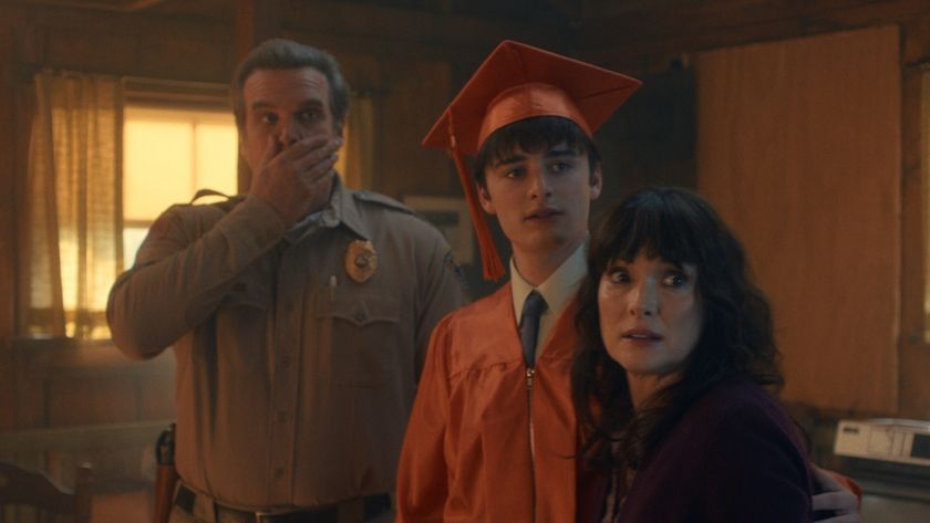 Hopper, Will in graduation gown and Joyce in Stranger Things Season 5 finale