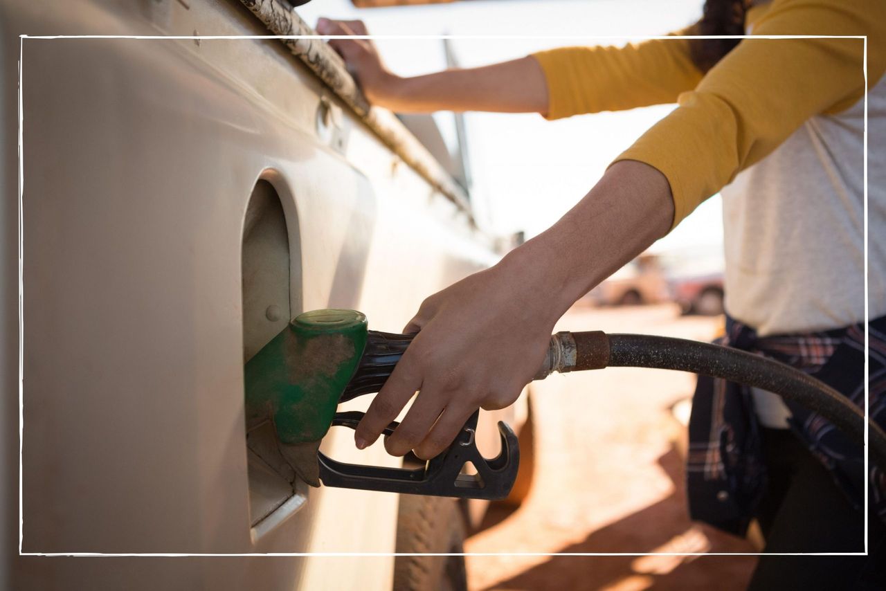 Man filling up his car with the cheapest fuel