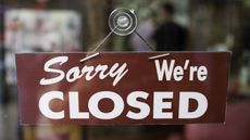 Sorry, we're closed sign hanging in window