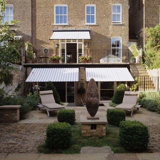 awning ideas: tiered awning in modern garden