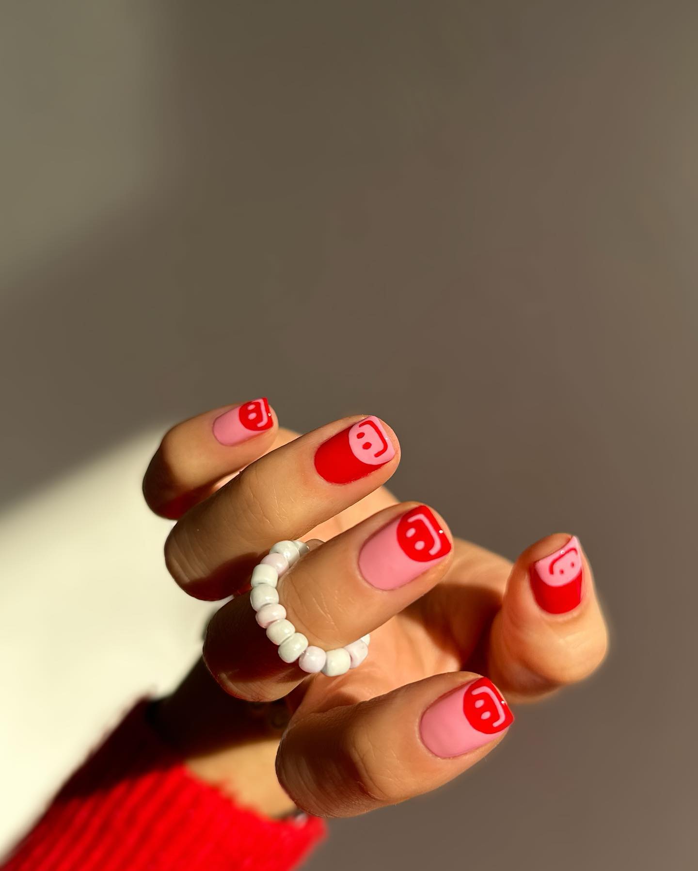 Smiley face manicure by Hang Nguyen