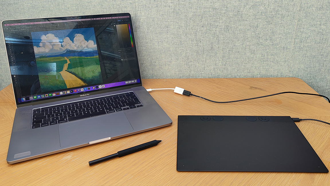 Wacom Intuos Pro review; a drawing tablet connected to a laptop