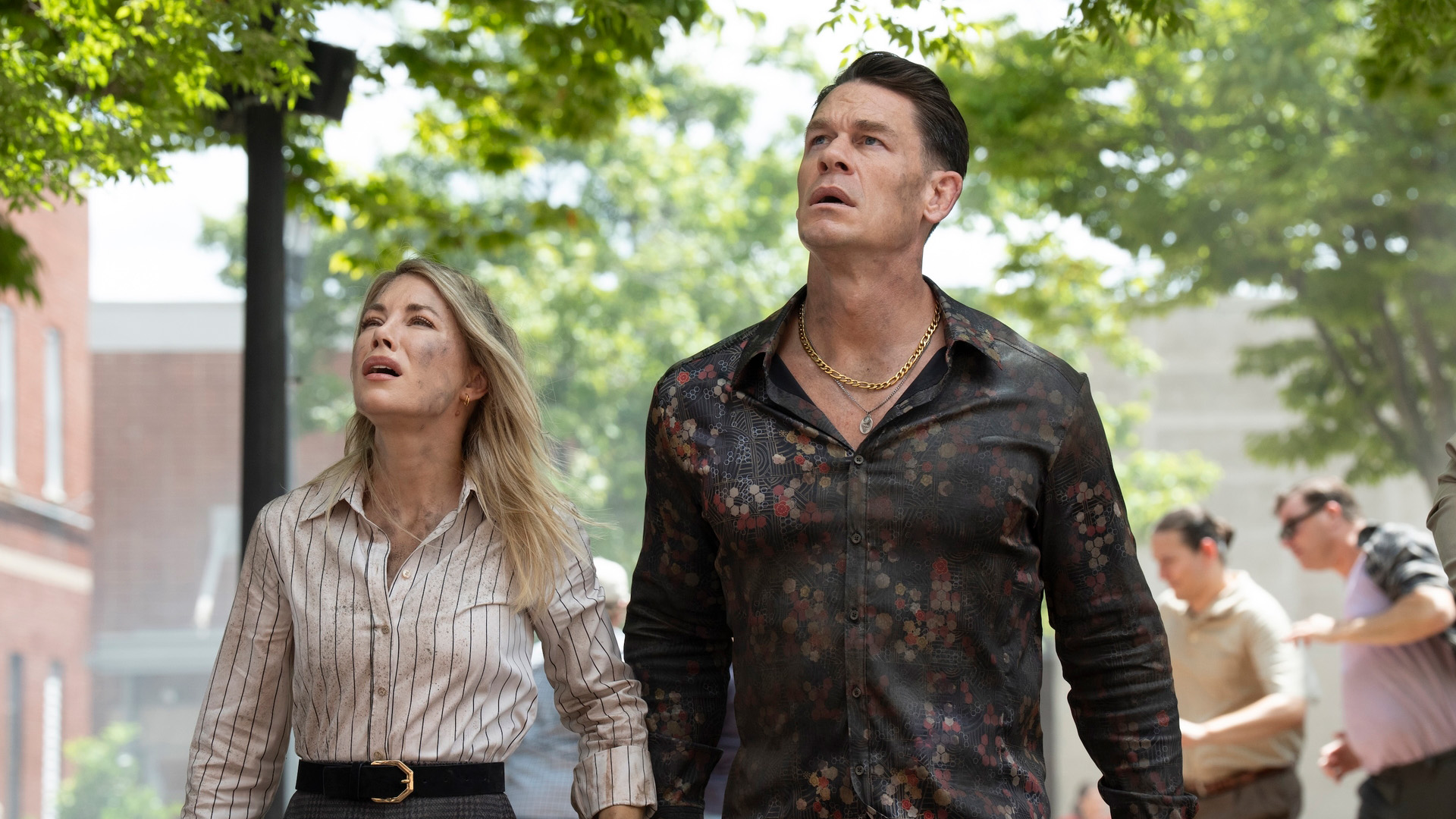 Jennifer Holland as Harcourt and John Cena as Peacemaker in Peacemaker season 2, episode 3.